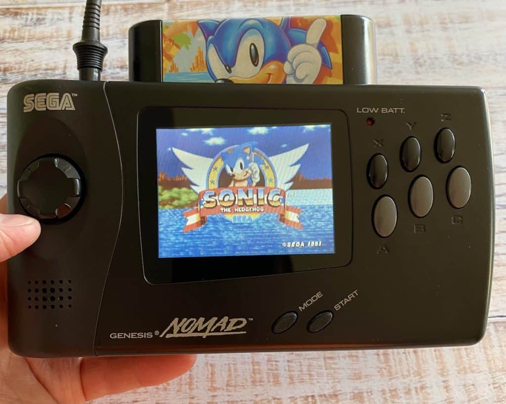 Sega Genesis Nomad front with Sonic 1 playing