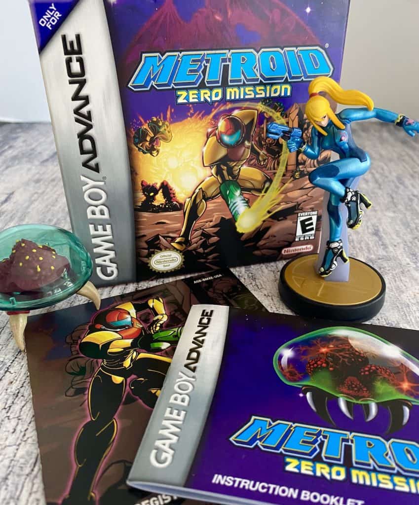 Metroid Zero Mission box, manual, insert and Zero Suit Samus amiibo with Metroid figure