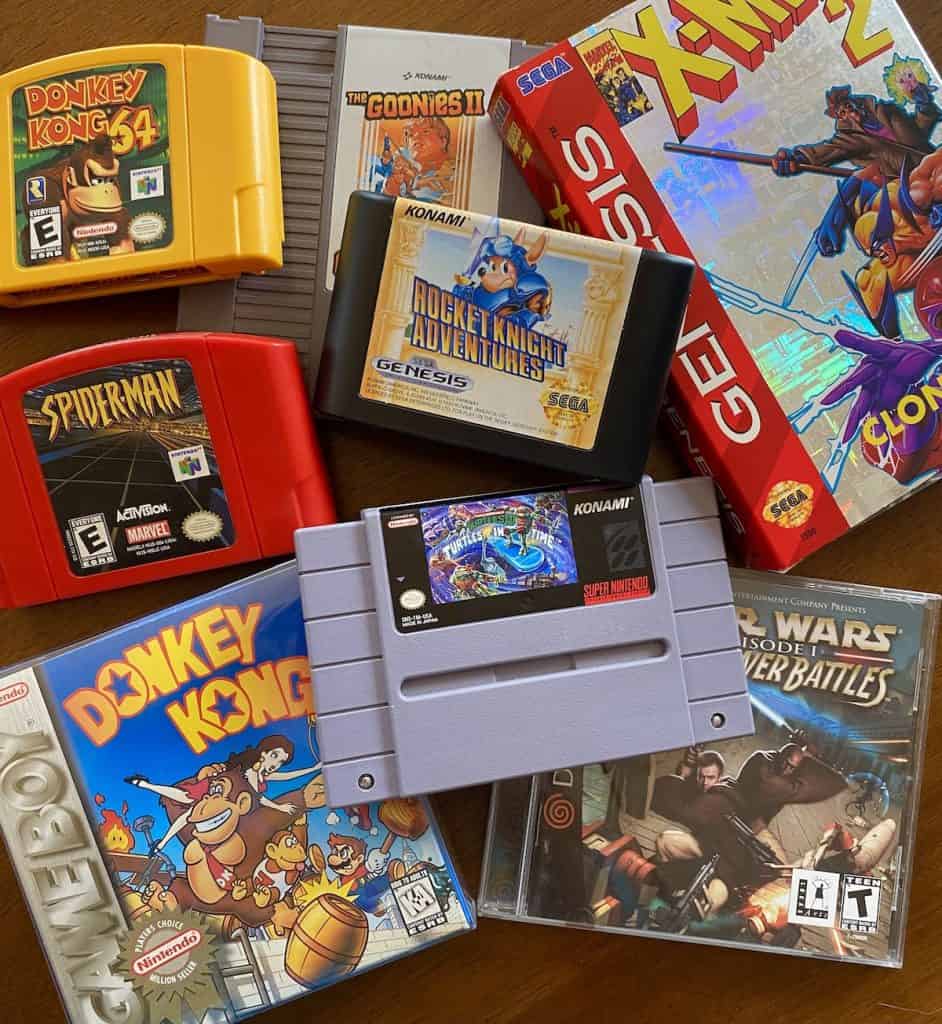 Collage of retro game carts: Donkey Kong 64, Spider-Man for N64, Donkey Kong (Gameboy), Turtles in Time, Star Wars Jedi Power Battles, Rocket Knight Adventures, X-Men 2 Clone Wars for Genesis